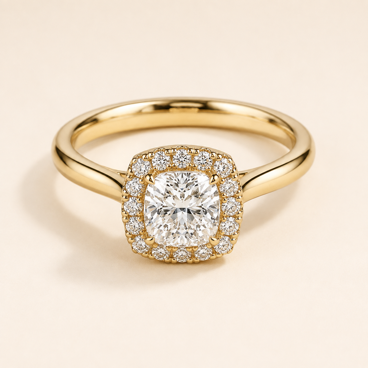 CHÔHANÉ Prairie Solitaire Halo Cushion Setting in 18K yellow gold on warm ivory